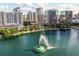 Stunning aerial view of the city skyline, with a serene lake and fountain in the foreground, showcasing the vibrant cityscape at 322 E Central Blvd # 1412, Orlando, FL 32801