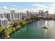 Aerial view of a city skyline along the water with fountain feature and blue sky at 322 E Central Blvd # 1412, Orlando, FL 32801