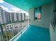 A condo balcony with blue floors, white railing, and a view of the city skyline at 322 E Central Blvd # 1412, Orlando, FL 32801