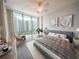 Relaxing bedroom with large windows, a cozy bed, and scenic city views at 322 E Central Blvd # 1412, Orlando, FL 32801