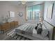 Staged bedroom featuring a large window with a view, modern furnishings, and neutral tones at 322 E Central Blvd # 1412, Orlando, FL 32801