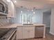 Well-appointed kitchen features stainless appliances, modern lighting, and ample counter space at 322 E Central Blvd # 1412, Orlando, FL 32801