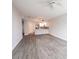 Open-concept living room and kitchen area with tile floors and modern lighting fixtures at 322 E Central Blvd # 1412, Orlando, FL 32801