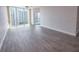 Spacious living area with modern flooring and a large window showcasing scenic city and water views at 322 E Central Blvd # 1412, Orlando, FL 32801