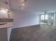 Bright living room featuring modern finishes, an open-concept design, and large windows with water views at 322 E Central Blvd # 1412, Orlando, FL 32801