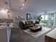 Bright living room featuring modern decor, stylish furniture, and scenic water views at 322 E Central Blvd # 1412, Orlando, FL 32801