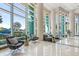Spacious lobby with comfortable seating area, tall ceilings, and expansive windows allowing natural light to flood the space at 322 E Central Blvd # 1412, Orlando, FL 32801