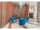 Modern lobby area featuring chic blue chairs, decorative lighting, and warm wood paneling for a luxurious feel at 322 E Central Blvd # 1412, Orlando, FL 32801