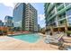 Upscale building amenities include a pool, lounge chairs, and beautiful landscaping at 322 E Central Blvd # 1412, Orlando, FL 32801
