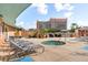 Relaxing roof deck featuring a hot tub, BBQ grills, lounge chairs, and city views at 322 E Central Blvd # 1412, Orlando, FL 32801