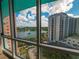 Stunning window view showcasing a peaceful lake and city buildings at 322 E Central Blvd # 1412, Orlando, FL 32801