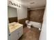 Nicely tiled bathroom with vanity, mirror, toilet, and tub for comfort and convenience at 415 Wymore Rd # 101, Altamonte Springs, FL 32714