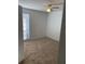 Bedroom showcasing a ceiling fan and a bright window at 415 Wymore Rd # 101, Altamonte Springs, FL 32714