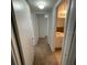 Clean hallway connecting different areas of the home, enhancing accessibility to the bathroom at 415 Wymore Rd # 101, Altamonte Springs, FL 32714