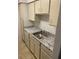 Bright kitchen with granite counters, stainless sink and ample cabinetry for storage and functionality at 415 Wymore Rd # 101, Altamonte Springs, FL 32714