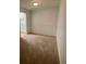 Cozy living room with carpet and access to the kitchen providing flexibility for furniture arrangements at 415 Wymore Rd # 101, Altamonte Springs, FL 32714