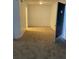 Inviting carpeted living room for an easy transition with a neutral color pallete and space for decor at 415 Wymore Rd # 101, Altamonte Springs, FL 32714