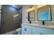 Modern bathroom with dual sinks and glass enclosed shower at 482 Marion Oaks Mnr, Ocala, FL 34473
