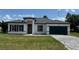 Charming single-Gathering home with a modern design, well-manicured lawn, and paved driveway at 482 Marion Oaks Mnr, Ocala, FL 34473