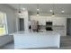 Bright kitchen with a large island, stainless steel appliances, and ample counter space at 482 Marion Oaks Mnr, Ocala, FL 34473