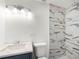 Modern bathroom featuring marbled shower, new vanity and fixtures at 4925 Catfish Rd, Lake Wales, FL 33898