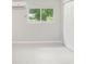 Bedroom with large window providing lots of light, closet, and marble floors at 4925 Catfish Rd, Lake Wales, FL 33898