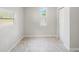 Cozy bedroom with large windows, closet, and marble floors at 4925 Catfish Rd, Lake Wales, FL 33898