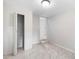 Bedroom with closet, gray walls, marble patterned tile, and access to another room via a small step-up at 4925 Catfish Rd, Lake Wales, FL 33898