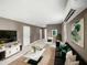 Living room with stylish decor, marble floors, plush sofa, marble coffee table, and a mini-split air conditioner at 4925 Catfish Rd, Lake Wales, FL 33898