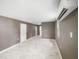 Spacious living room with neutral walls, modern lighting, white trim and marble floors at 4925 Catfish Rd, Lake Wales, FL 33898