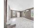 An open-concept living space boasts modern tile floors, mini-split and updated windows at 4925 Catfish Rd, Lake Wales, FL 33898