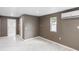 Comfortable living room featuring marble floors, a window view, and neutral wall color at 4925 Catfish Rd, Lake Wales, FL 33898