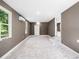 Empty room with a tile floors, neutral paint, natural light, mini split, ready for customization at 4925 Catfish Rd, Lake Wales, FL 33898