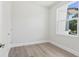 Bright, well-lit bedroom with large window and wood-style floors provides comfort and style at 523 Sanctuary Golf Pl, Apopka, FL 32712