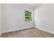 Cozy bedroom with ample natural light and hardwood flooring at 523 Sanctuary Golf Pl, Apopka, FL 32712
