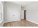 Bedroom with hardwood floors, double closets, and ensuite bathroom provides ample space and convenience at 523 Sanctuary Golf Pl, Apopka, FL 32712