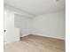 Bonus room featuring hardwood floors and neutral walls provides a flexible living space at 523 Sanctuary Golf Pl, Apopka, FL 32712