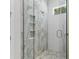 The bathroom features a shower with patterned tile and a glass enclosure at 523 Sanctuary Golf Pl, Apopka, FL 32712