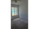 Bedroom featuring carpeted floor and a window at 5396 Lonesome Dove Dr, Kissimmee, FL 34746