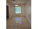 Bright dining room with a window, neutral paint, tile flooring and modern lighting at 5396 Lonesome Dove Dr, Kissimmee, FL 34746