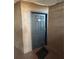 Unit 315 door with a black door mat in a brown hallway at 5725 Gatlin Ave # 315, Orlando, FL 32822