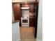 Kitchen with black refrigerator, granite countertops, and white range stove at 5725 Gatlin Ave # 315, Orlando, FL 32822