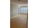 Empty living room with tile floor, white walls and one window with blinds at 5725 Gatlin Ave # 315, Orlando, FL 32822