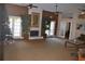 Cozy lounge area featuring a stone fireplace, comfortable seating, and ample space for relaxation at 5725 Gatlin Ave # 315, Orlando, FL 32822