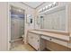 Retro bathroom with a tub, vanity, and great lighting fixture for your everyday needs at 616 Woodridge Dr, Casselberry, FL 32730