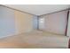 Spacious bedroom with carpet floors, neutral paint, and plenty of natural light at 616 Woodridge Dr, Casselberry, FL 32730