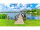 Community dock offering waterfront access and a serene spot for relaxing and enjoying the lake views at 616 Woodridge Dr, Casselberry, FL 32730