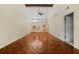 Expansive living room featuring vaulted ceilings, wood floors, and neutral tones at 616 Woodridge Dr, Casselberry, FL 32730