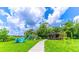 Community playground with swings, slides, and lush green space perfect for outdoor fun at 616 Woodridge Dr, Casselberry, FL 32730