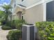 Exterior shot of a home showing landscaping and an air conditioning unit at 6416 S Goldenrod Rd # 8A, Orlando, FL 32822